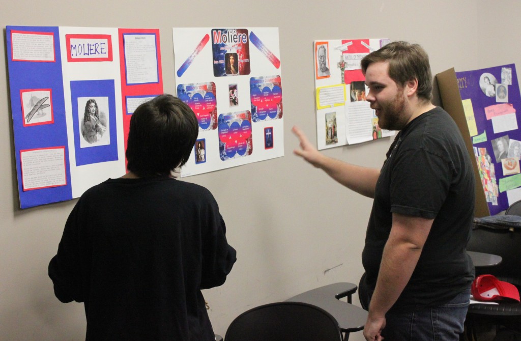 Otterbein students prepare to show classmates the posters they have made summarizing their research papers.